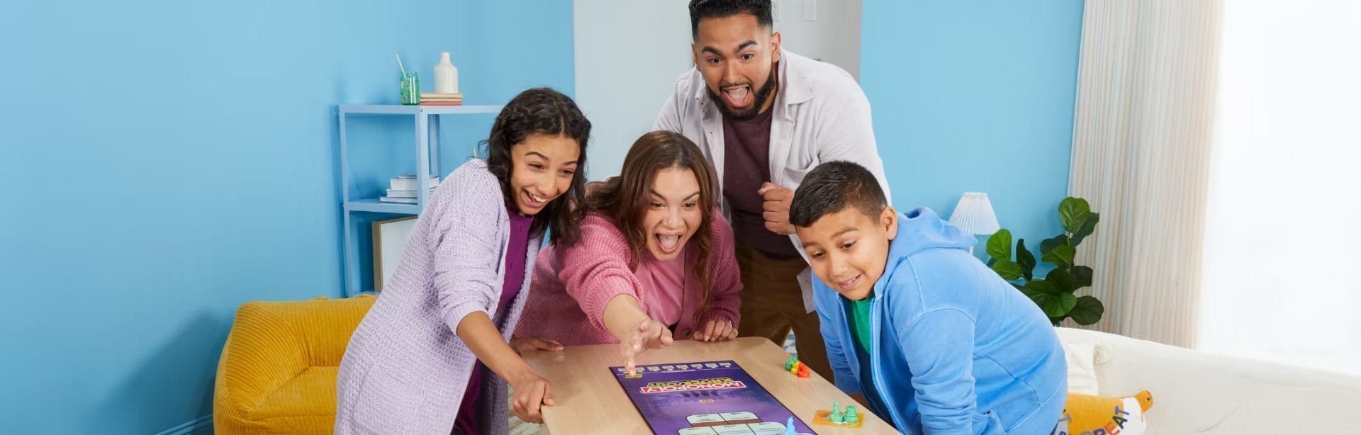 Family playing monoply