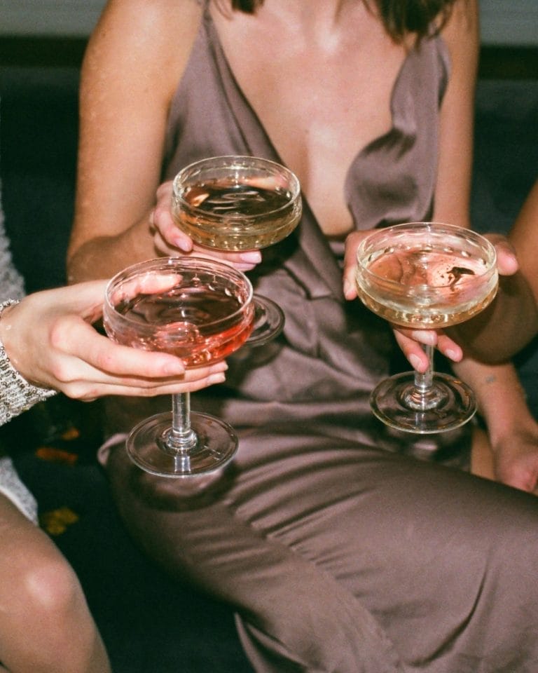 Women holding drinks